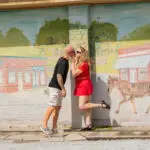 Matt and Amy of the Peddler's Post posing in front of the mural at Floral City Hardware, Floral City, FL.