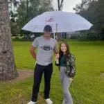 Austin and wife our August 2023 Hernando County Umbrella Winners posing with umbrella. at the Hernando County High School Field
