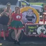 Matt and Amy of the Peddler's Post in Inverness, FL 2021 Christmas Parade and our brand release.