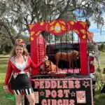 Amy dressed up as the Ringleader posing with dogs dressed up as lions at the 4th Annual Monster Car Show with the Boys and Girls Club of Hernando County.2023