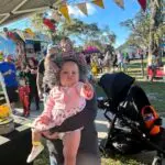 Baby dressed as an old lady at the 4th Annual Monster Car Show with the Boys and Girls Club of Hernando County.2023