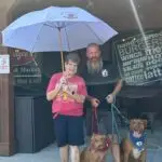 Matt, Gus, Gracie posing with Patricia our September 2024 Citrus County Umbrella Winner out front of Pudgees located in Floral City FL